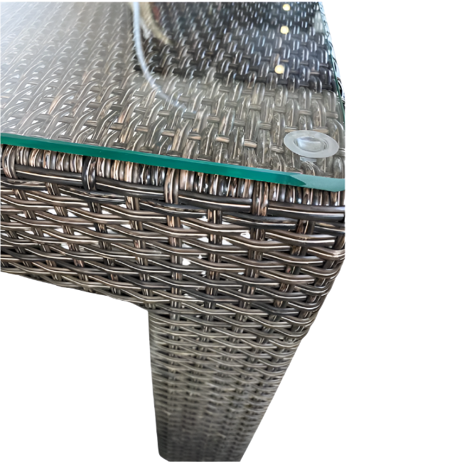 Wicker chair with a glass top on a white background