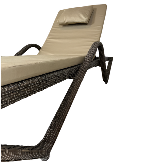 Beige cushioned lounge chair with woven frame on a white background