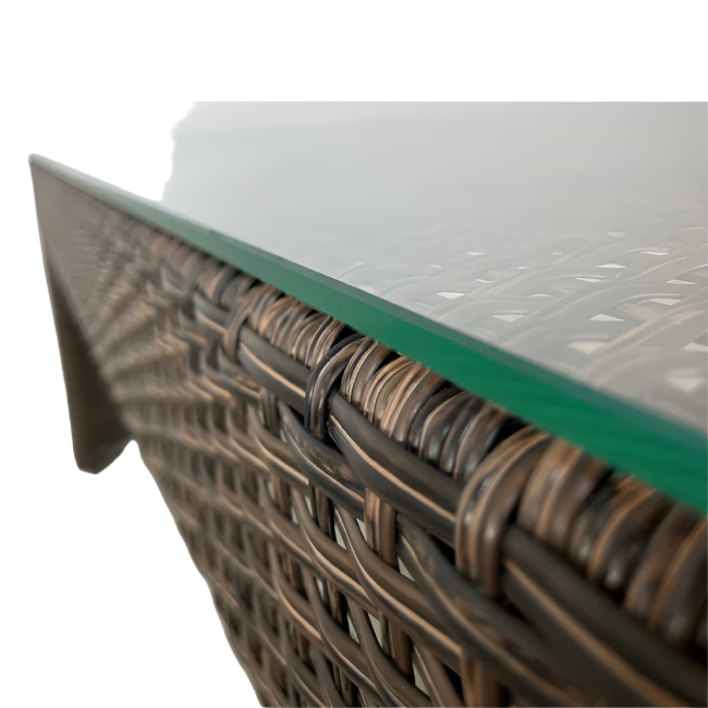 Close-up of a wicker table with a glass top