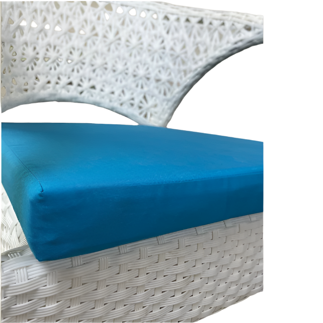 Blue cushion on a white wicker chair