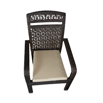 Wicker chair with a beige cushion on a white background