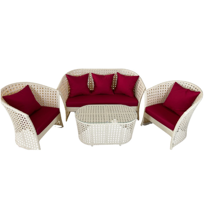 White wicker outdoor furniture set with red cushions on a white background