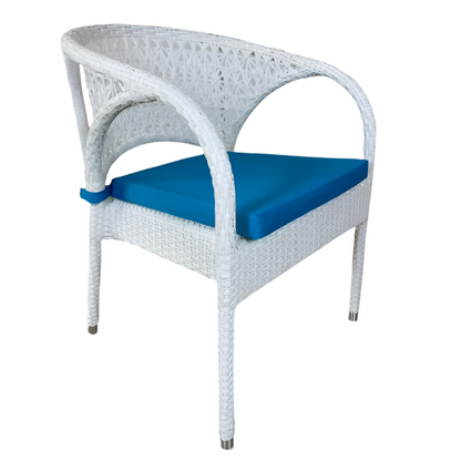 White wicker chair with blue cushion on a beige background